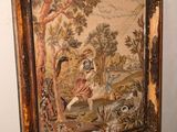 a picture of a painting hanging on a wall next to a dresser