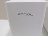 a white box with the word xtol written on it
