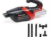 an image of a black and red corded vacuum with tools