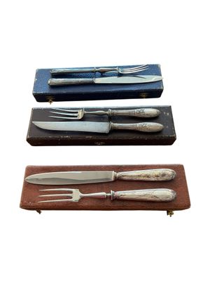 three different types of knifes and forks in a case