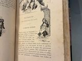 an open book with illustrations on it sitting on a table