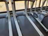 three tread machines in a row in the gym