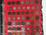 a red bind with a bunch of coins in it