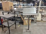 a metal table with a metal top in a warehouse
