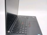 a laptop with a black keyboard on a white surface