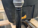 the microphone is attached to the back of the monitor