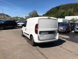 a white van that is parked in a parking lot