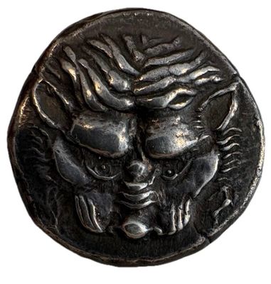 une image d'une pièce de monnaie sur laquelle figure un visage