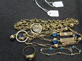 a lot of jewelry that is on display on the table