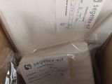 a box with a package of toilet paper inside of it