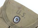a close up of a military pouch with a button on it