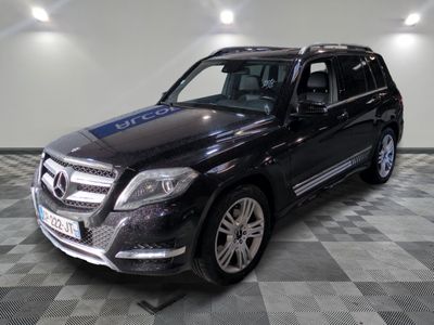 a picture of a black mercedes suv parked in a garage