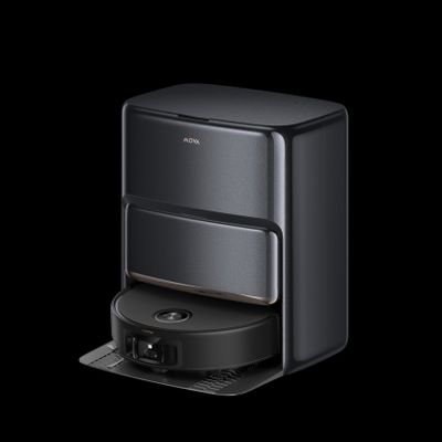 a close up of a coffee maker on a black background