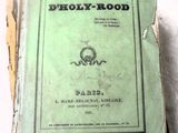 un vieux livre posé sur une table