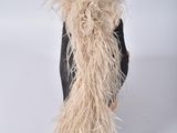 a woman that is wearing a furry hat and a coat