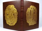an old book with a gold plated design on the cover