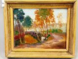 une image représentant un tableau d'une route de campagne dans un cadre doré