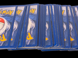 a lot of pokemon cards sitting on top of each other