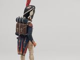 figurine of a soldier with a drum and a drum