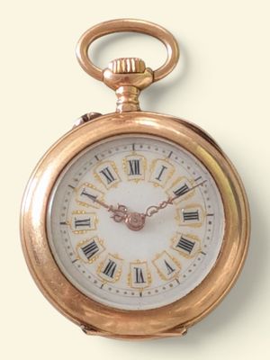 une montre de poche en or avec des chiffres romains