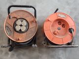 two reels that are sitting next to each other on the floor