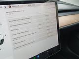 a laptop that is sitting on a desk in a car