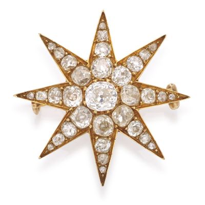une broche ancienne en forme d'étoile sertie de diamants