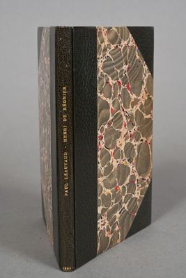 two books sitting on top of each other on top of a table