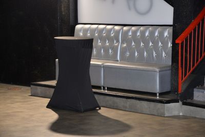 a couch and a table in the corner of a room