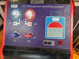 a picture of a refrigerant handling system in a garage