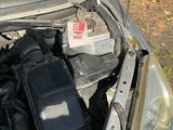 a car that has its hood open with the hood up