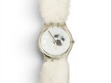 a white watch with a dog face on it ' s face