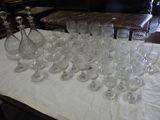 a lot of empty wine glasses on a table