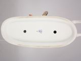 underside view of a white porcelain sink with a single faucet in the center
