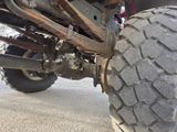 a close up view of the front of a four - wheeler vehicle