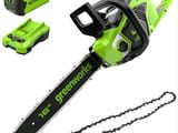 a greenworks corded chainsaw with two batteries and a battery