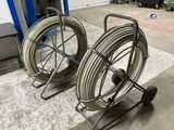 two hoses that are sitting on a cart