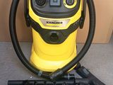 a close up of a yellow and black vacuum on a floor