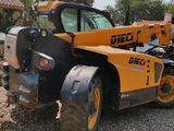 a picture of a construction vehicle parked on a gravel lot