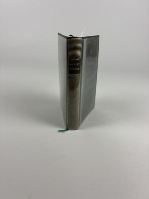 the book is open and sitting on a white surface