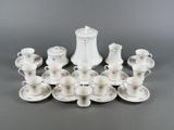 a lot of cups and saucers that are on the table