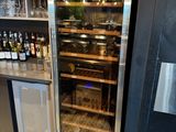 a wine cooler in the corner of the room