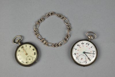 three different types of pocket watches on a table