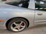 a silver car that is parked in a parking lot