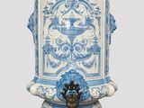 a blue and white water dispenser sitting on a table