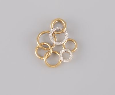 a close up of a gold and diamond broochle