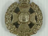 a close up of a badge on a white surface