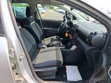 the interior of a car with the door open showing the driver ' s seat