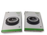 two boxes of robot vacuum cleaners sitting on top of each other