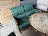 a couch and a table in a room with wood floors